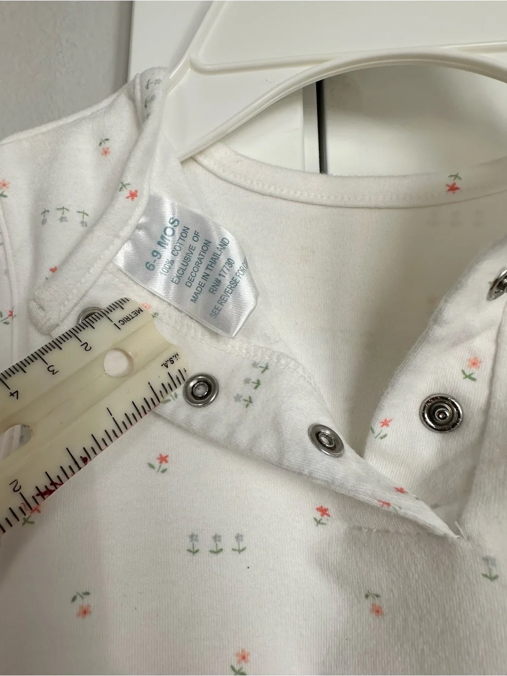 Cherokee baby play-wear. White Baby Onesie with Tiny Pink & Green Floral Print